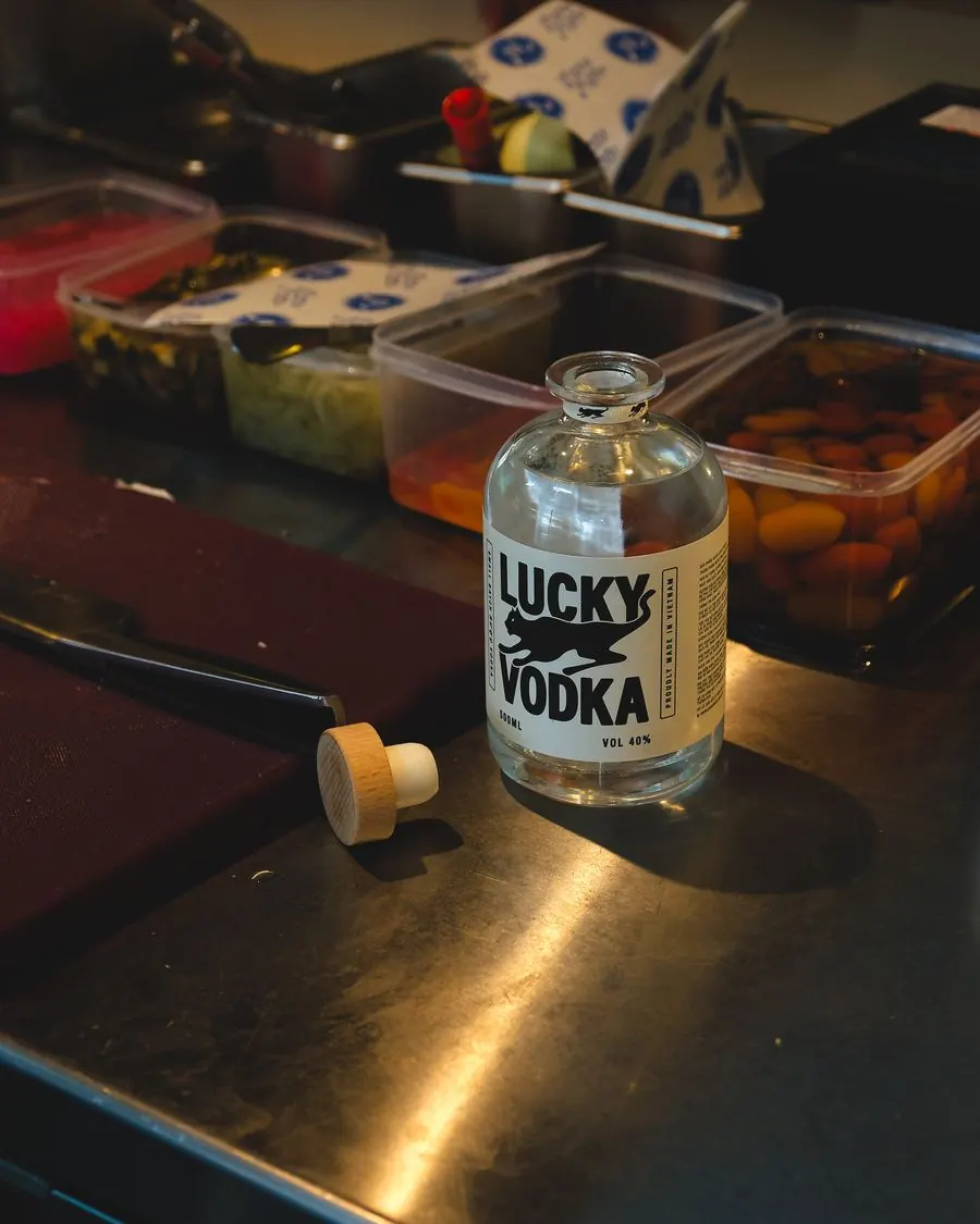 A bottle of Lucky Vodka on a stainless steel bar